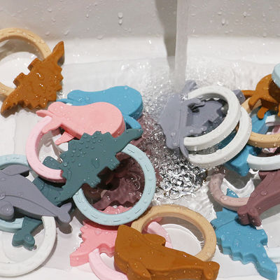 Игрушка Teether младенца силикона мультфильма с формой енота единорога пингвина