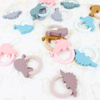 Игрушка Teether младенца силикона мультфильма с формой енота единорога пингвина
