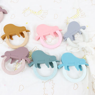Игрушка Teether младенца силикона мультфильма с формой енота единорога пингвина